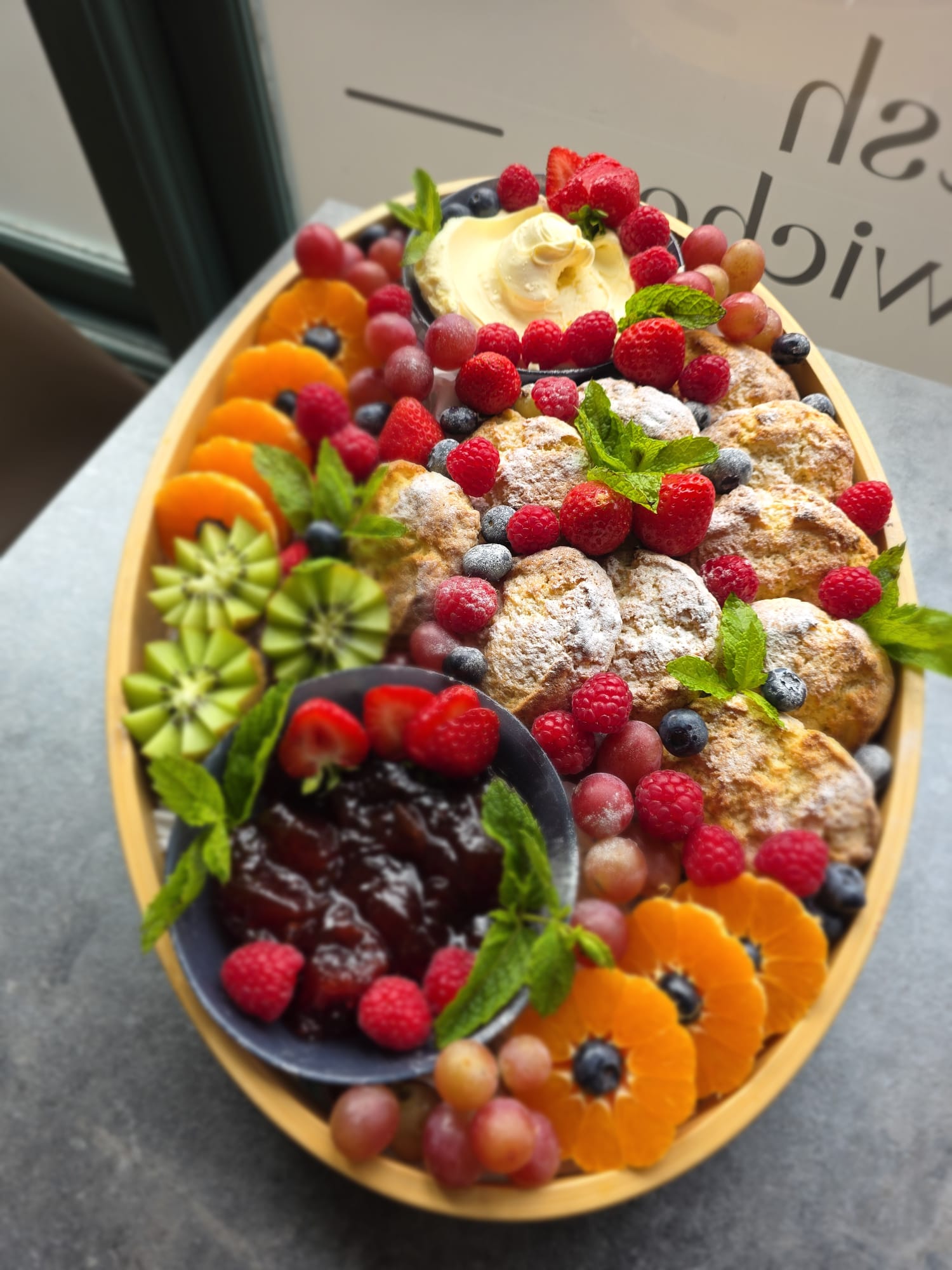 Scone and fresh fruit platter